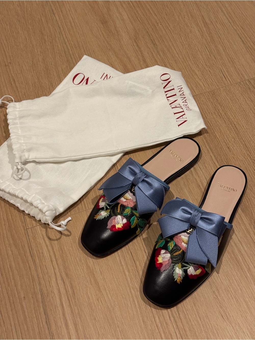 Valentino Garavani Black Leather Floral Embroidered Mules with Blue Bow